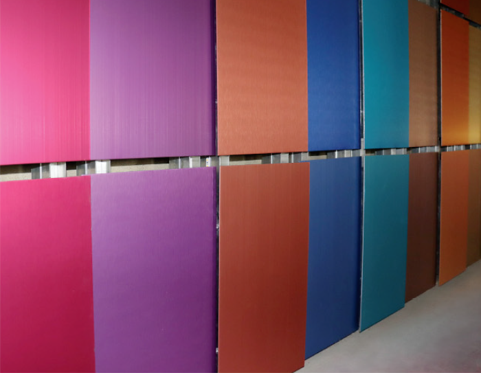 Colorful aluminum panels in pink, purple, red, blue, teal, brown, and orange