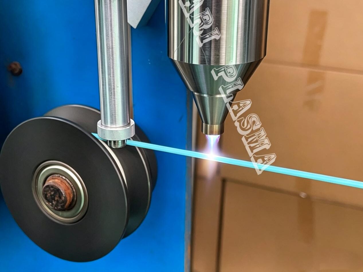 Atmospheric plasma jet treating cable before printing