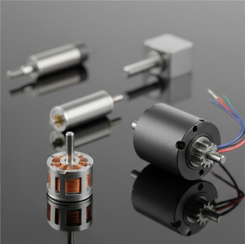 electric motors in different shapes and sizes on a reflective surface