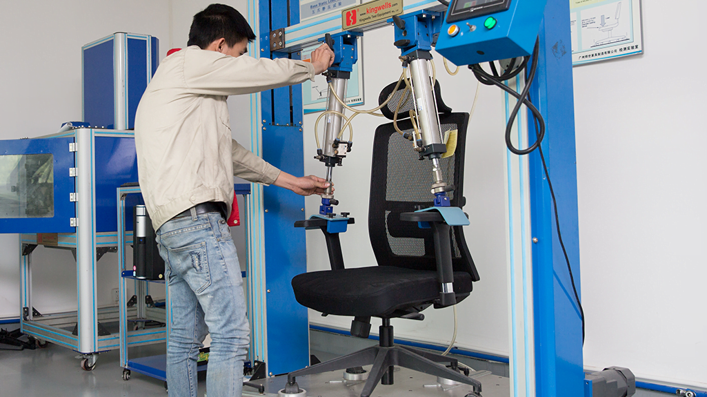 Armrest strength test on a VASEAT office chair