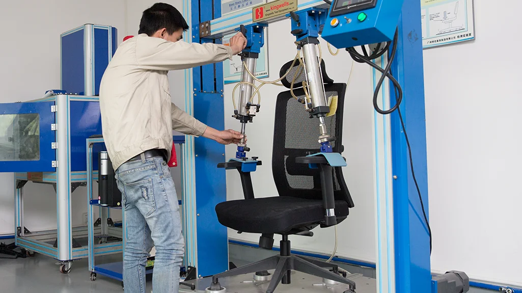 Armrest strength test on a VASEAT office chair